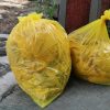 yellow plastic bag on gray concrete floor